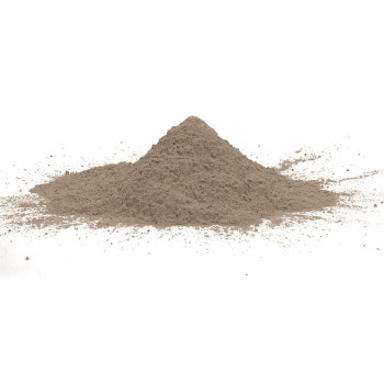A small mound of fine, beige powder rests on a plain white background, appearing static and undisturbed.