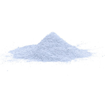 A small conical pile of fine, light blue powder sits on a smooth, white surface, against a plain white background.