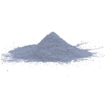 A small, grayish pile of powder rests on a white surface, spread slightly at the base.