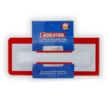 A red and white grouting trowel is attached to a blue packaging card. Text includes: `COLOTOOL LLANA DE REJUNTE PRO PRO GROUTING