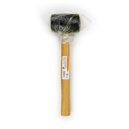 A rubber mallet with a wooden handle is wrapped in clear plastic, placed against a plain white background. Text on the handle re
