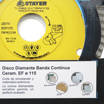 A yellow circular saw blade labeled `STAYER Turbo Extrafino Profesional` designed for cutting ceramic and masonry. Text includes