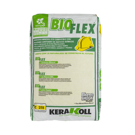 Bag of Kerakoll BioFlex adhesive resting upright, featuring green and yellow branding. Text: `Adhesivo Mineral Eco-Compatible co