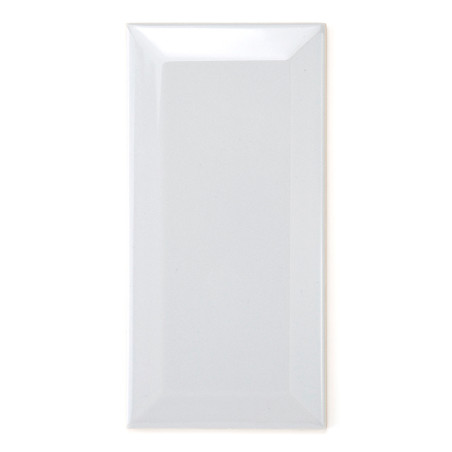 A glossy white rectangular tile reflects light, emphasizing its smooth surface, with slightly beveled edges, set against a plain