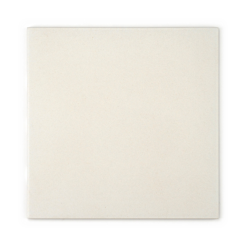 A plain, square ceramic tile rests against a white background, featuring a smooth, matte, light beige surface with no text or pa
