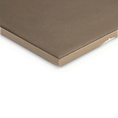 A square, smooth, brown tile with a slightly beveled edge rests against a white background, highlighting its thickness and textu