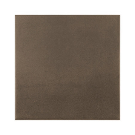 A square, matte, dark brown tile rests on a white background, appearing smooth and uniform in texture, with no visible text.