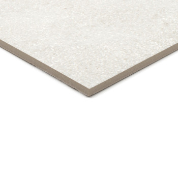 A rectangular, speckled light gray ceramic tile rests on a white surface, showcasing its thin profile and smooth, textured finis