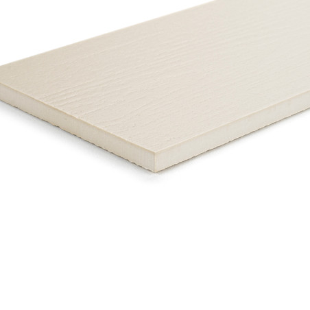 Un carreau rectangulaire de couleur claire repose à plat sur une surface blanche, affichant un aspect lisse et légèrement textur