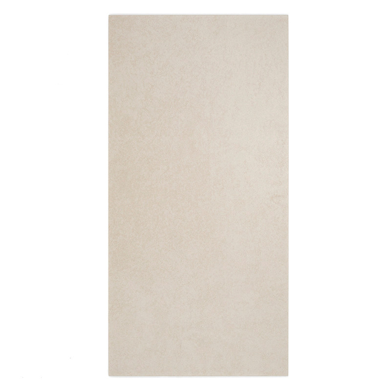 A rectangular tile rests vertically, featuring a smooth, beige surface with subtle texture, against a plain white background.