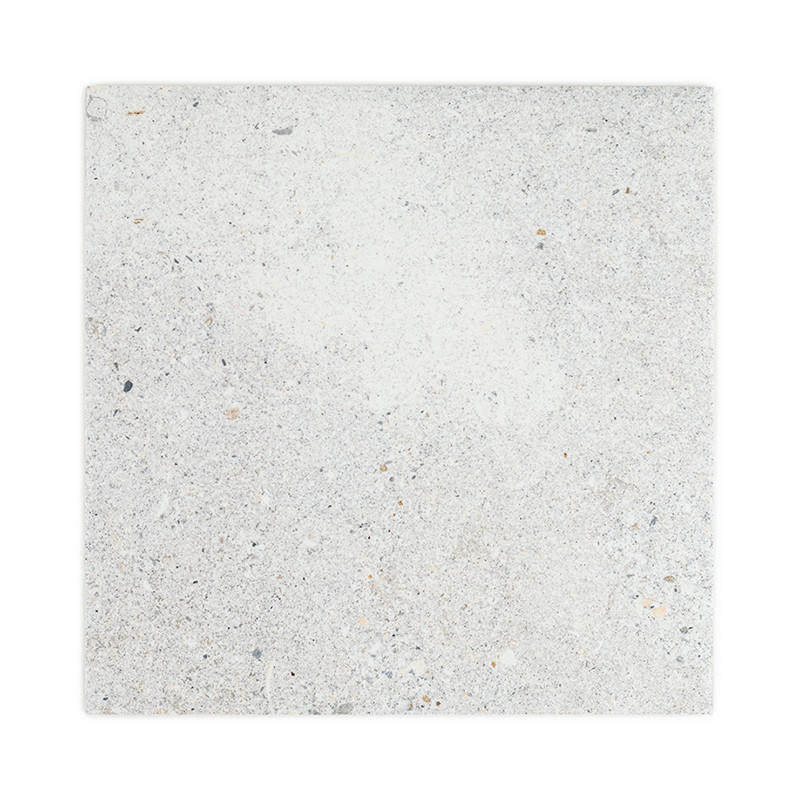 The object is a square stone tile, featuring a speckled, textured surface with gray and beige tones, set against a white backdro