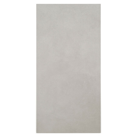 Un carreau gris rectangulaire et lisse est centré, reposant sur un fond blanc uni, créant une apparence minimaliste et épurée.
