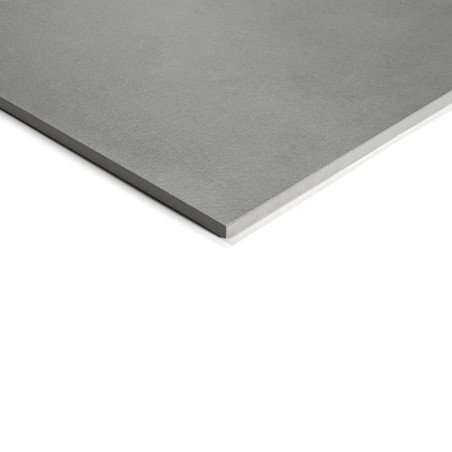 Un carreau gris lisse et rectangulaire aux bords nets repose sur un fond blanc, suggérant un design minimaliste moderne adapté a