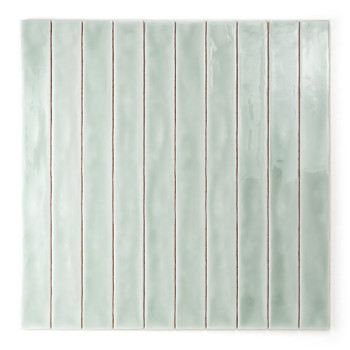 A narrow, vertical, glossy mint-green ceramic tile stands alone against a white background, showcasing its smooth texture and mi