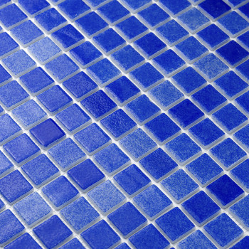 Blue glass tiles forming a mosaic pattern, creating a textured surface, possibly for a wall or floor.