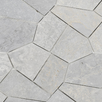 Gray stone tiles, arranged in an irregular geometric pattern, create an interlocking mosaic on building floor or wall.