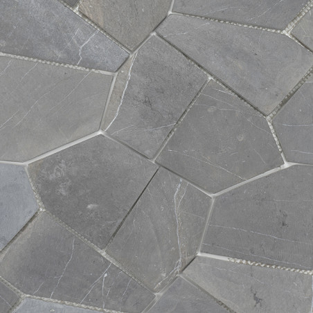 Irregular gray stone tiles form a mosaic pattern, interlocked tightly, showcasing a natural and textured surface in a uniform la