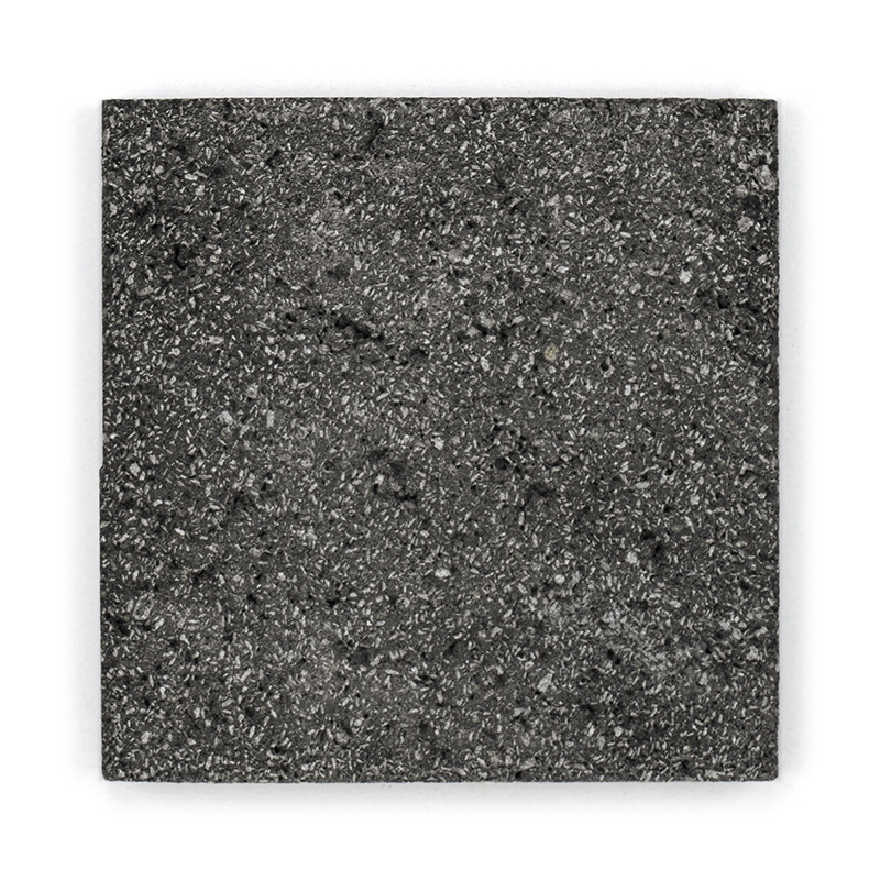 Square stone tile featuring a speckled, textured surface. resting flat against a white background.