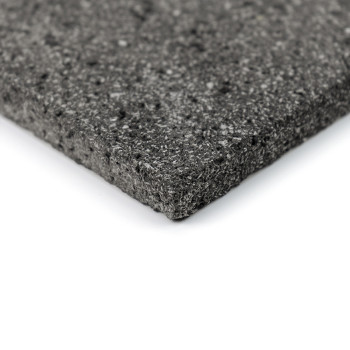 A textured gray stone tile, displaying a speckled surface, rests at an angle against a plain white background.