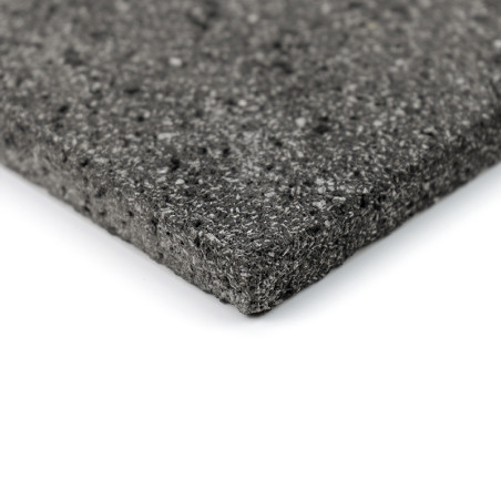 A textured gray stone tile, displaying a speckled surface, rests at an angle against a plain white background.