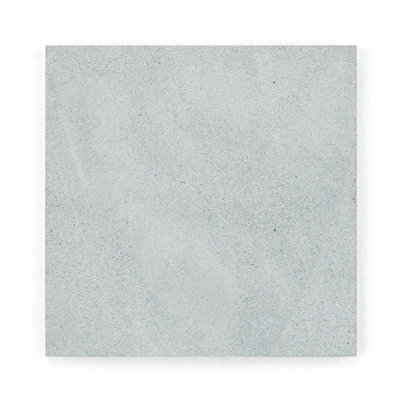 Square gray stone tile, lying flat, displaying a smooth, speckled texture in an isolated, white background.