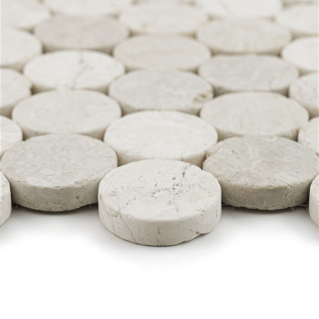 Circular stone tiles arranged closely together, forming a cohesive, textured surface in a uniform, light gray color.