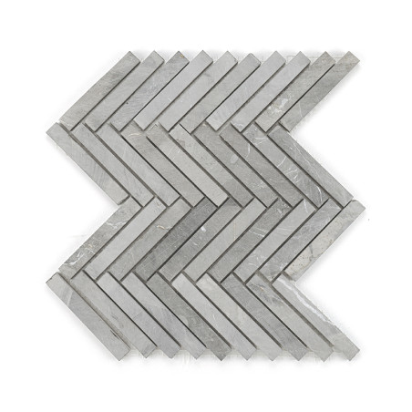 Gray stone tiles form a zigzag pattern, neatly arranged to create a continuous chevron design on a plain surface.