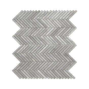 Gray stone tiles form a zigzag pattern, neatly arranged to create a continuous chevron design on a plain surface.