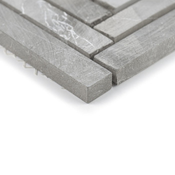 Gray stone tiles form a staggered pattern, showcasing rectangular pieces with subtle veins, arranged on a white background.