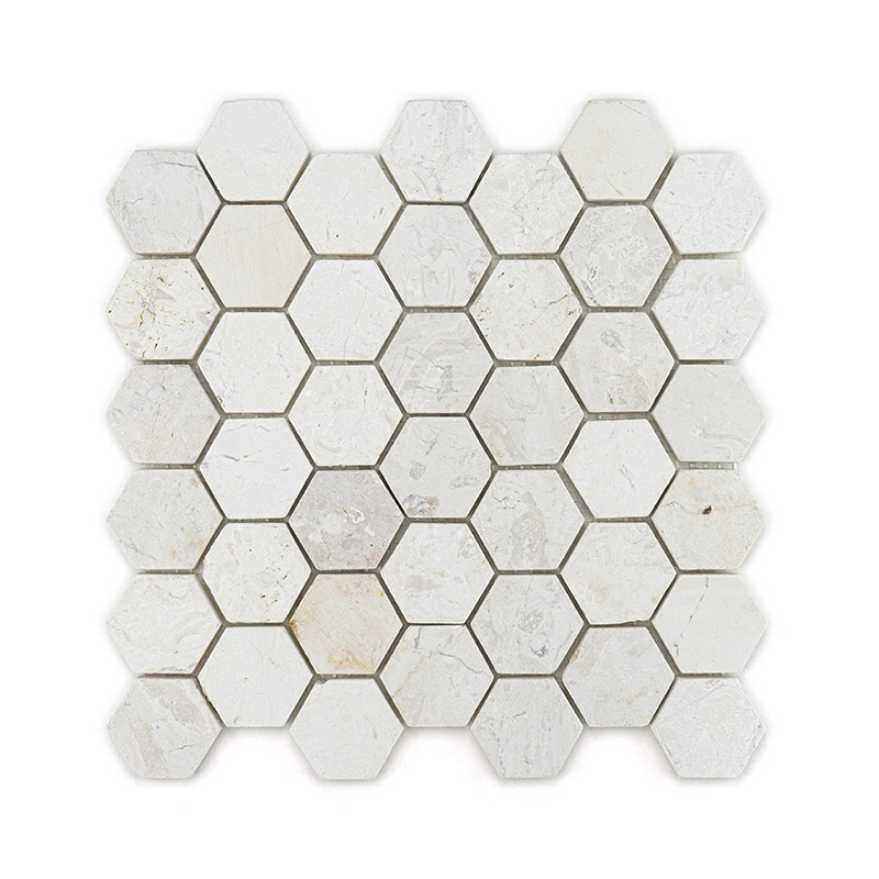 Hexagonal stone tiles arranged in a grid, displaying a mix of light beige and gray tones, creating a textured pattern.