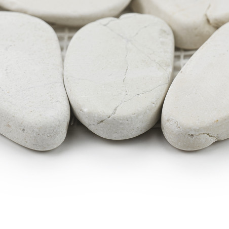 Smooth, white stone tiles rest closely together on a mesh backing, showcasing natural cracks and subtle texture.