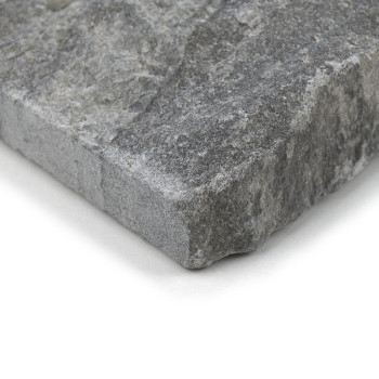 Gray stone tile, resting on a flat surface, features a rough, textured surface with various shades of gray.