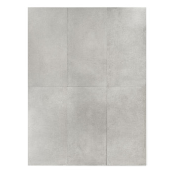 Un azulejo gris liso y rectangular está centrado, apoyado sobre un fondo blanco liso, creando una apariencia minimalista y limpi