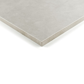 Um ladrilho quadrado cinza fosco repousa sobre uma superfície branca, suas bordas afiadas definindo um design limpo e minimalist