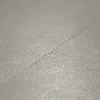 Un azulejo beige liso y ligeramente texturizado forma una superficie plana, llenando el marco con una costura sutil visible en d