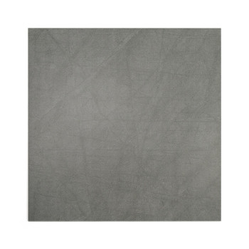 Un azulejo cuadrado presenta una superficie gris lisa y moteada, lo que sugiere una textura de piedra u hormigón. El fondo es co