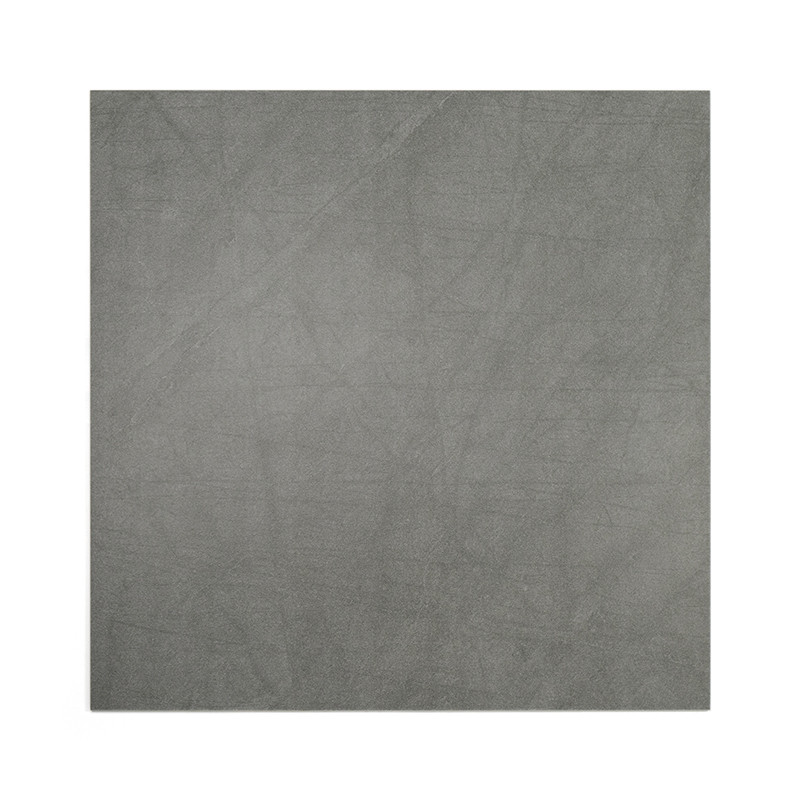 Un azulejo cuadrado presenta una superficie gris lisa y moteada, lo que sugiere una textura de piedra u hormigón. El fondo es co