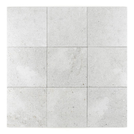 Nine light gray stone tiles are arranged in a three-by-three grid, displaying subtle speckles and earthy texture on a white back