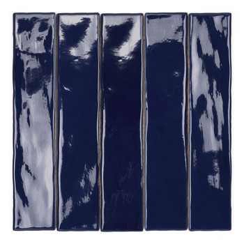 A long, glossy, deep blue rectangular tile rests on a plain white background, displaying subtle reflective patterns.