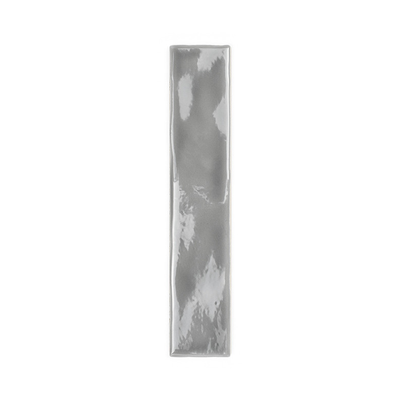 A rectangular, glossy gray tile reflects light subtly across its smooth surface. It’s set against a simple, white background.