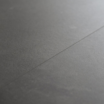 Smooth, dark gray ceramic tile lies flat with a subtle seam running through, creating a minimalist and modern surface appearance