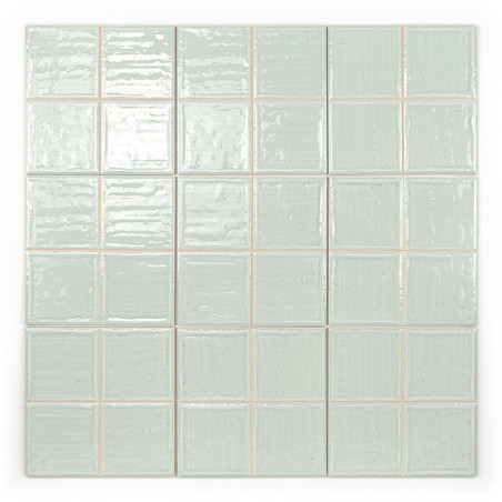 Square ceramic tiles, each with a glossy, uneven surface, are arranged in a neat 6x6 grid. light gray color dominates the image.