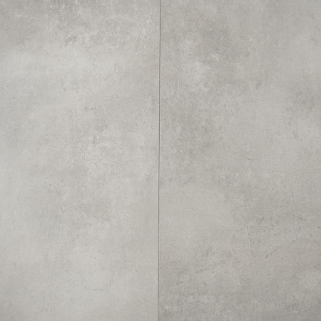 Revestimento cerâmico cinza com superfície de textura sutil, dividida por uma fina linha vertical. A textura lembra o concreto, 