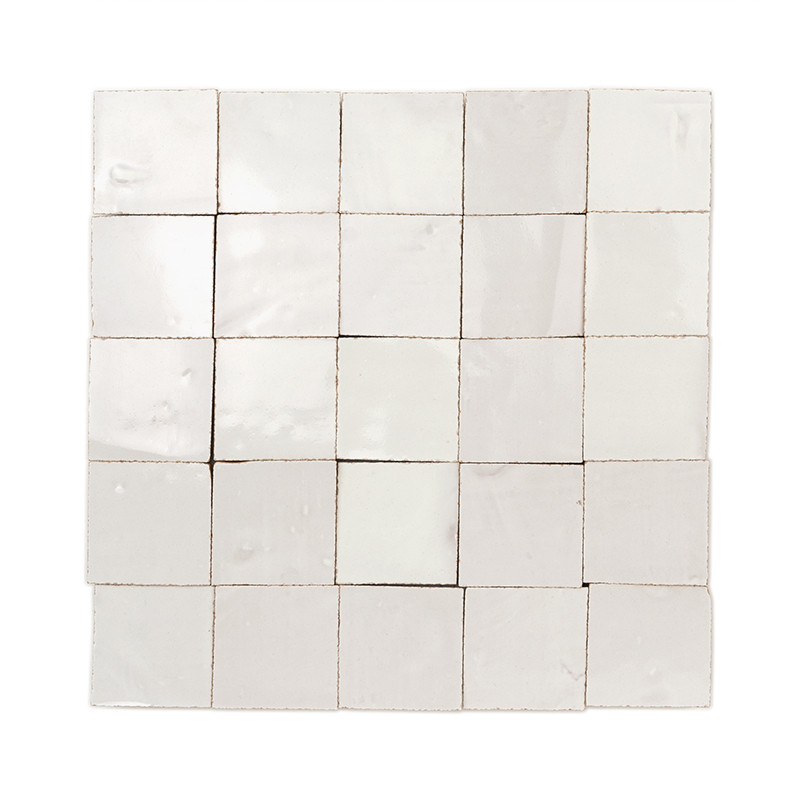 Square terracotta tiles, featuring glossy, uneven surfaces, arranged in a grid formation against a white background.