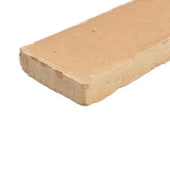 Rectangular terracotta tile lies flat, showcasing its smooth surface and rough edges, on a plain white background.