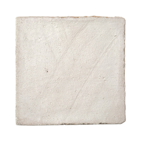 Square terracotta tile appears textured, resting against a plain white background, showcasing its rough, uneven surface.