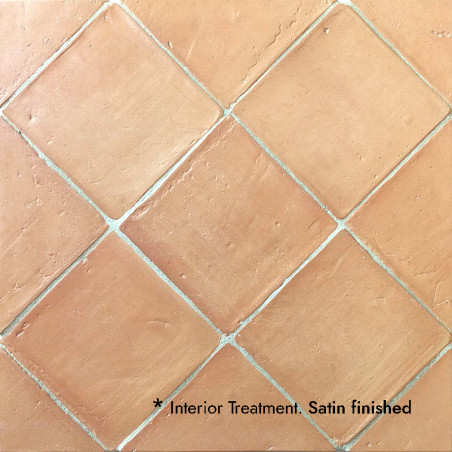 Terracotta tiles arranged in a diamond pattern, showcasing a satin finish. Text reads: `*Interior Treatment. Satin finished.`