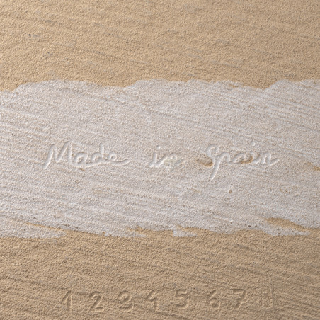 The tile features embossed text reading `Made in Spain` and numbers `1 2 3 4 5 6 7` on a textured beige surface.