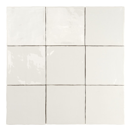 Nine glossy, white ceramic tiles are arranged in a three-by-three grid, reflecting light in an indoor setting.
