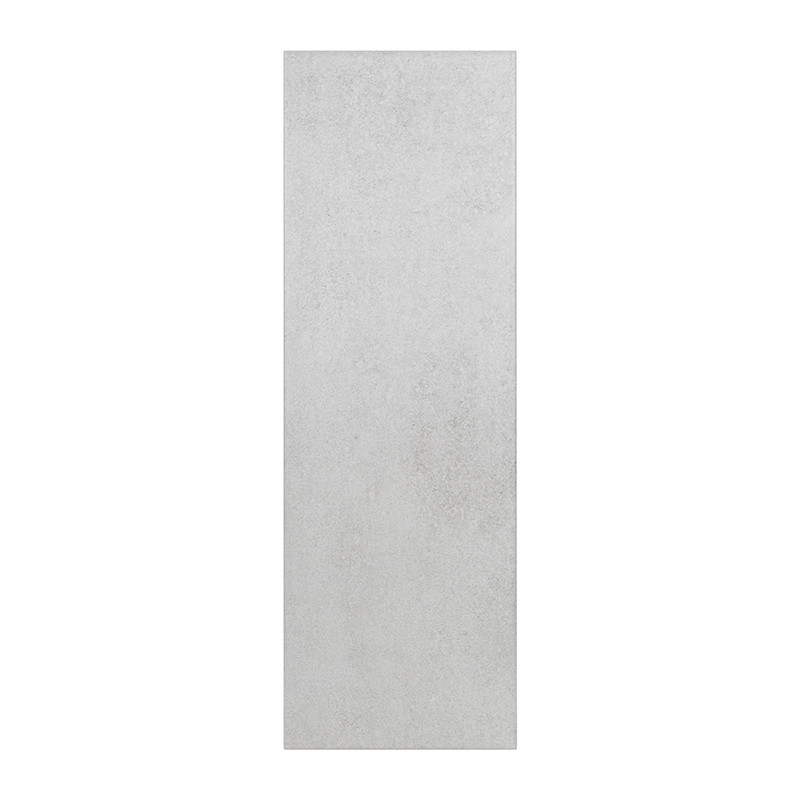 The tile is rectangular with a smooth, matte, light gray surface, suitable for flooring or wall installations in modern interior